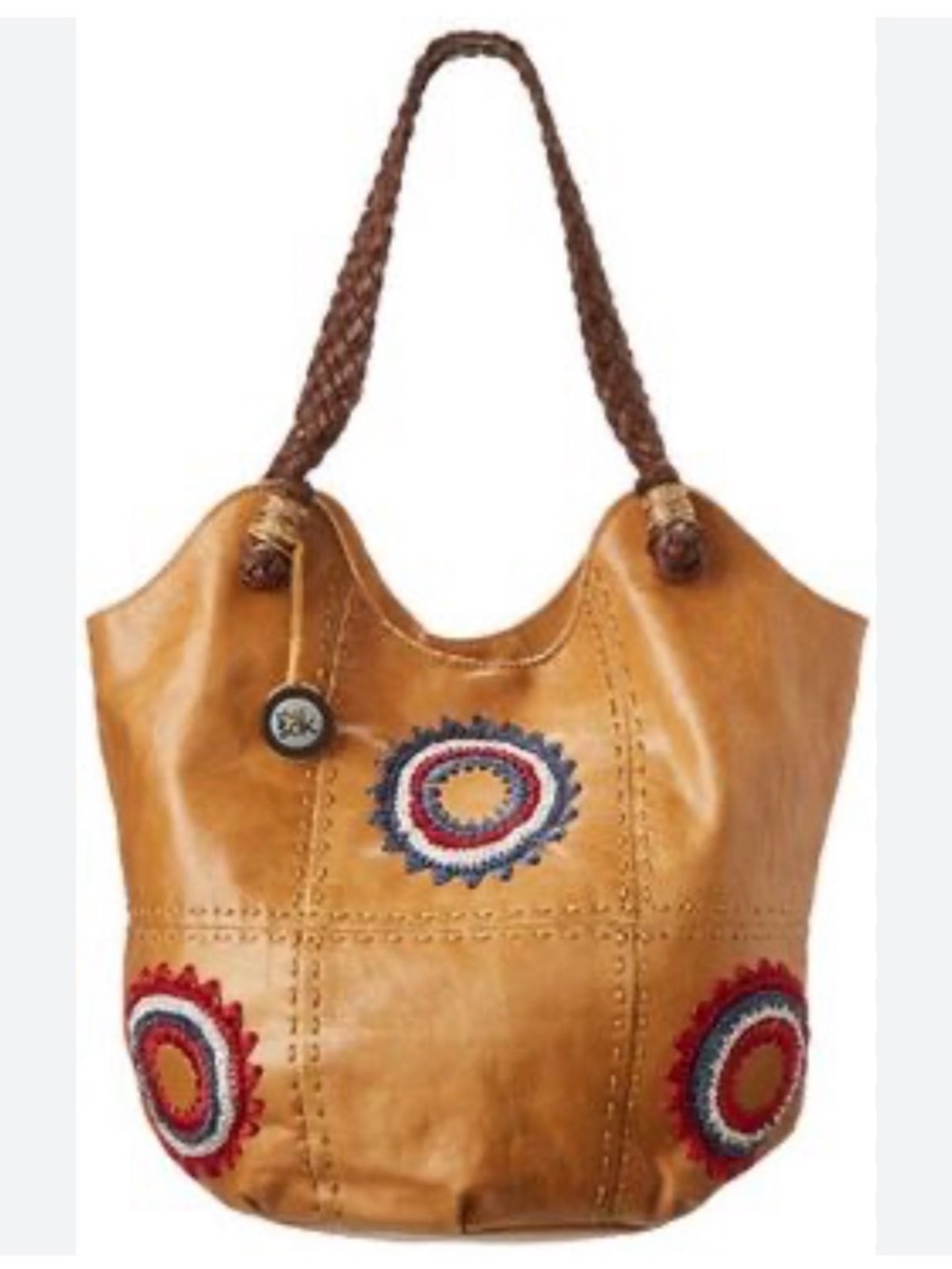 The Sak Indio leather hobo bucket bag braided handles & flower detailing.